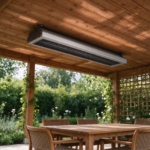 Ceiling-mounted infrared heater under the solid roof of a covered pergola above a dining table
