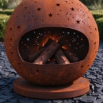 Close-up of the rust-orange corten surface and star cut-outs